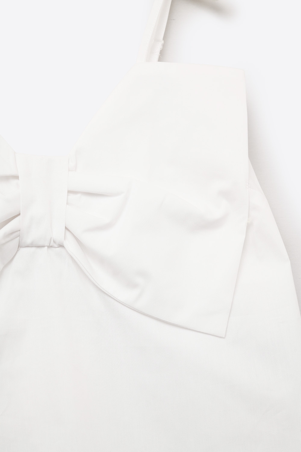 Top de popelín blanco con detalle de lazo Top de popelín blanco con detalle de lazo