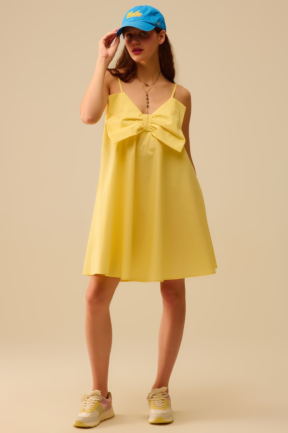 Minivestido de popelín amarillo con detalle de gran lazo Minivestido de popelín amarillo con detalle de gran lazo
