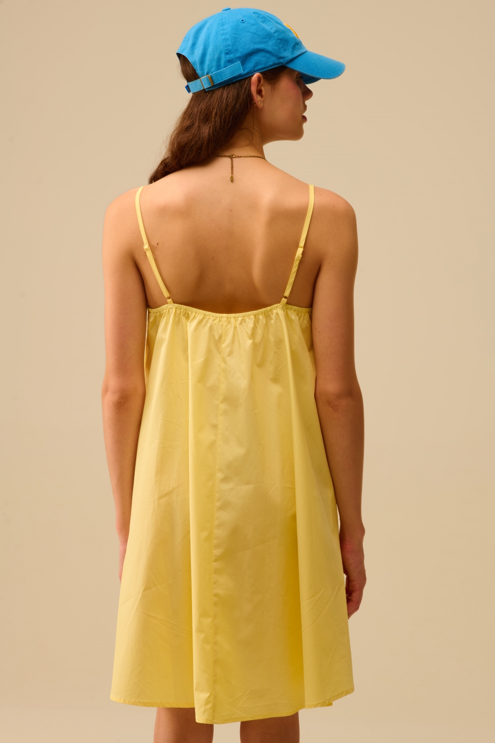 Minivestido de popelín amarillo con detalle de gran lazo Minivestido de popelín amarillo con detalle de gran lazo