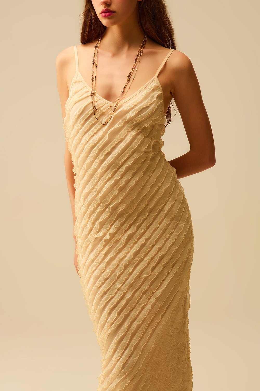 Maxi vestido crudo con flecos y tirantes