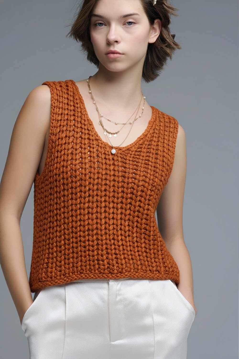 Chaleco corto de crochet en color naranja con hilo de lentejuelas Chaleco corto de crochet en color naranja con hilo de lentejuelas