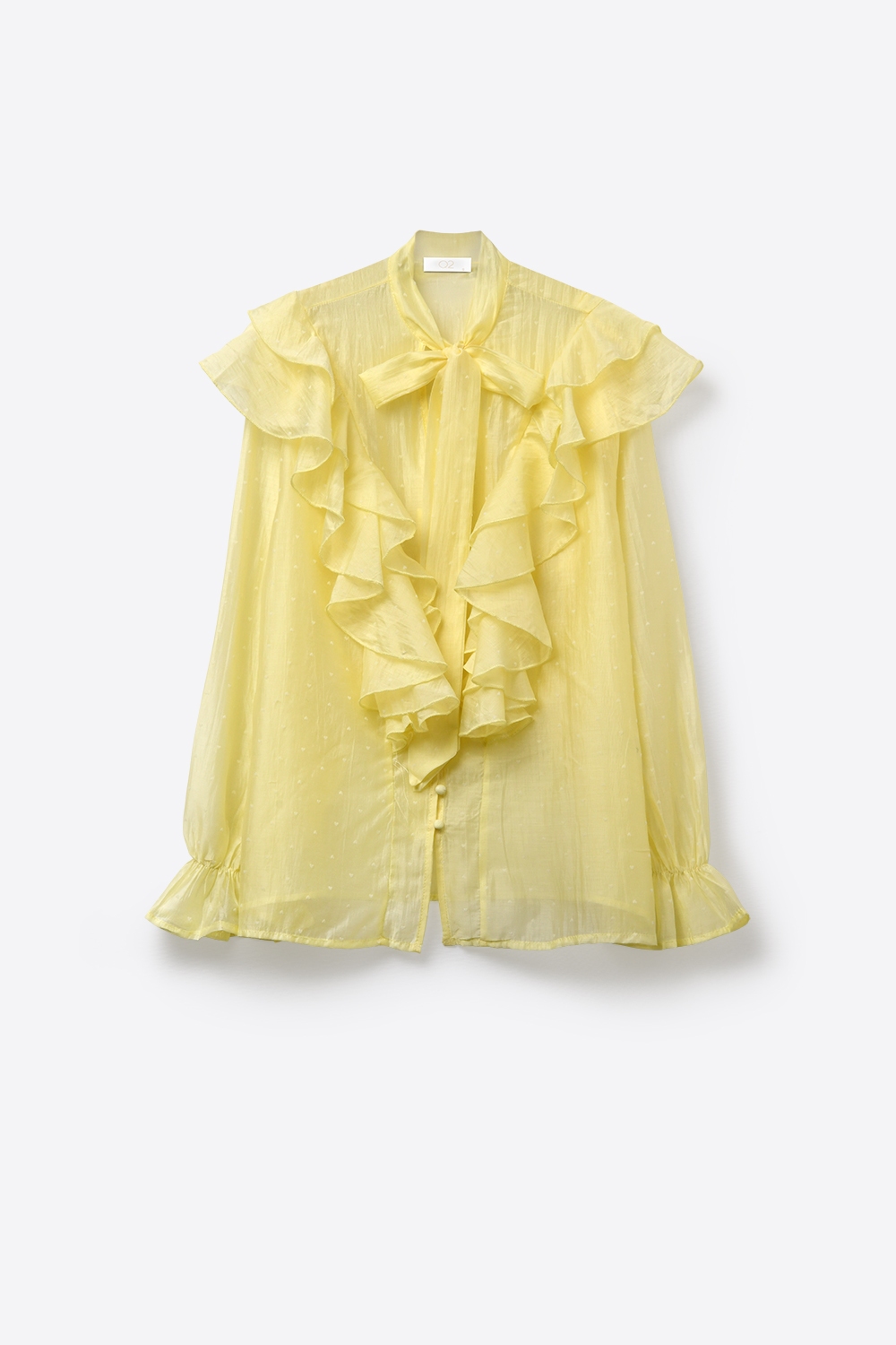 Blusa amarilla con volantes y lazo en el cuello