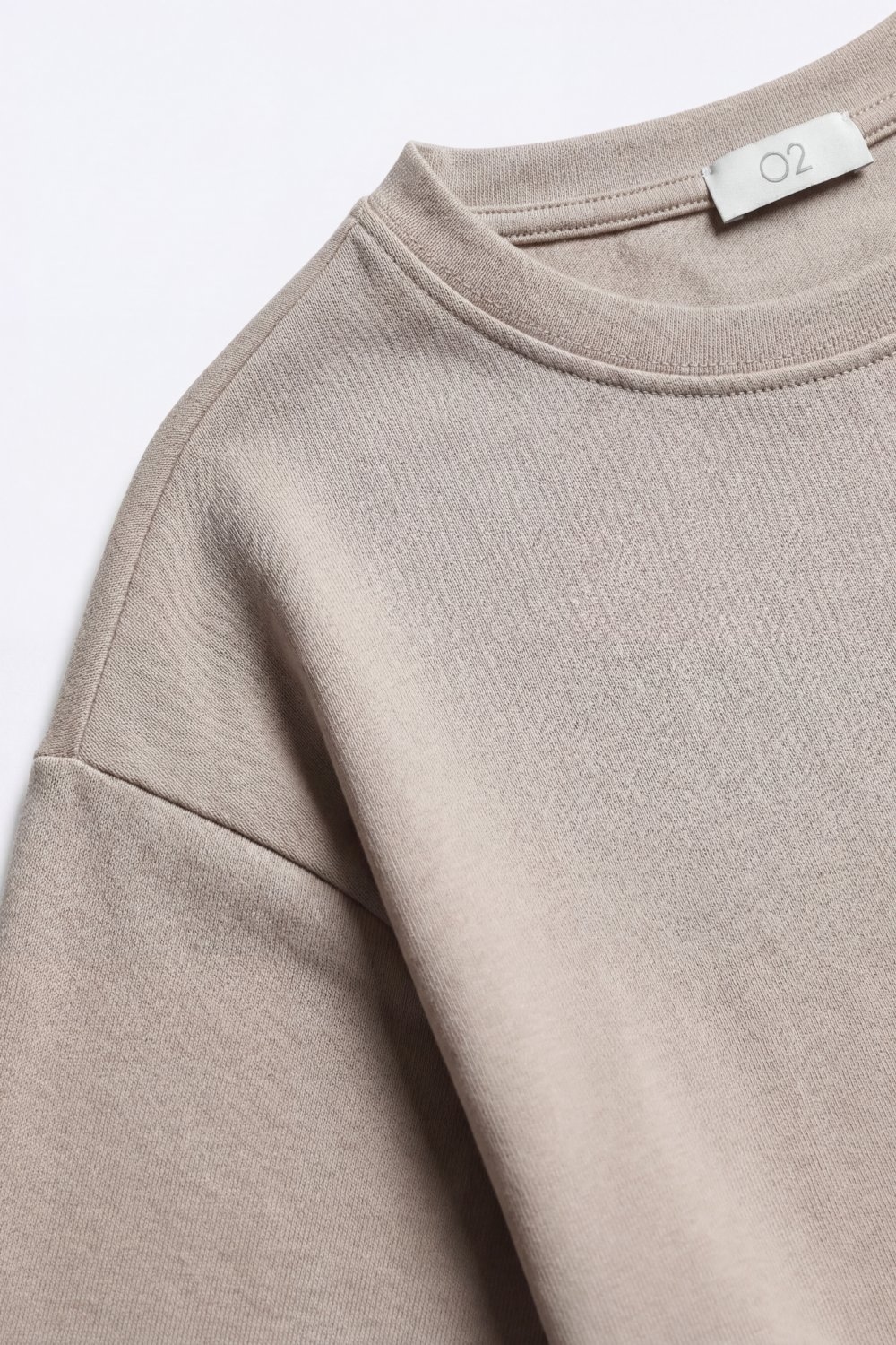 Camiseta de manga corta con ajuste relajado y cuello redondo en beige
