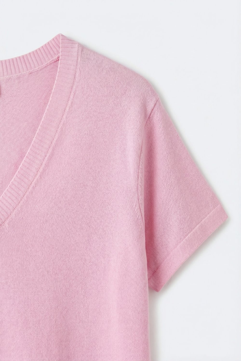 Jersey de punto rosa de corte relajado y cuello en V