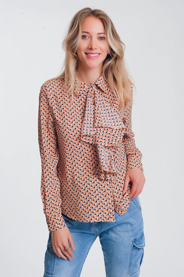 Blusa de manga larga con beige y detalle de volantes