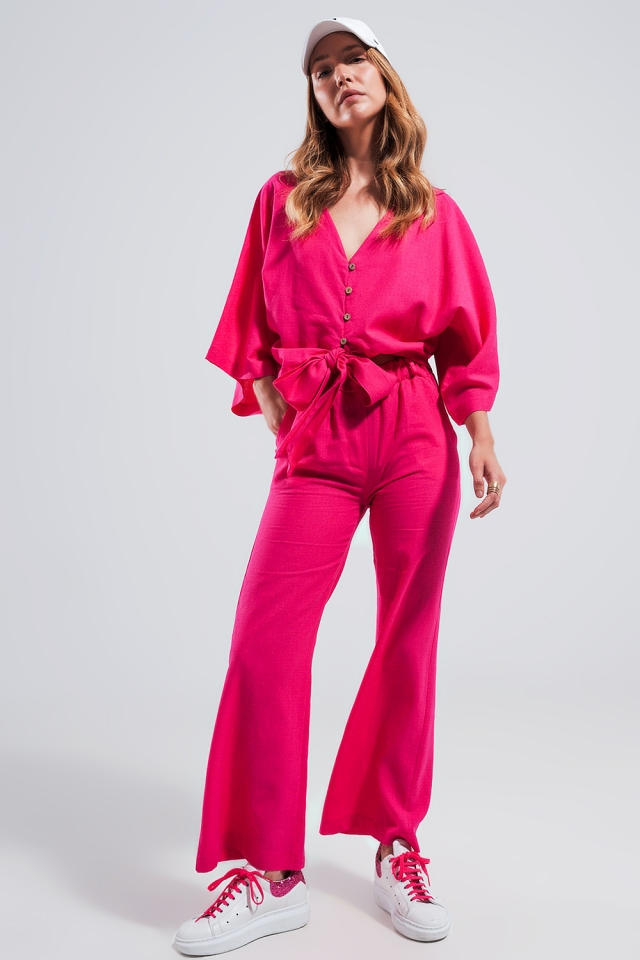 Mono largo fucsia con lazada en la cintura