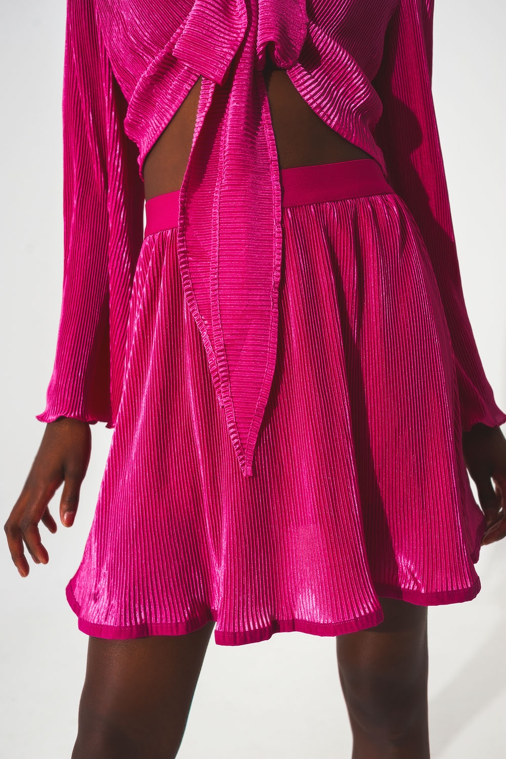Falda corta plisada en Fucsia Falda corta plisada en Fucsia