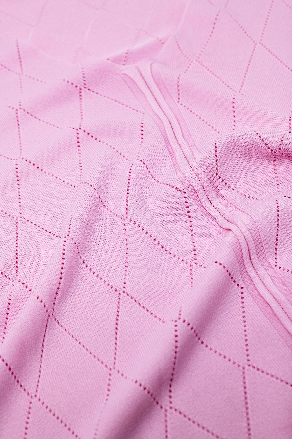 Jersey rosa claro de manga corta con estampado de rombos