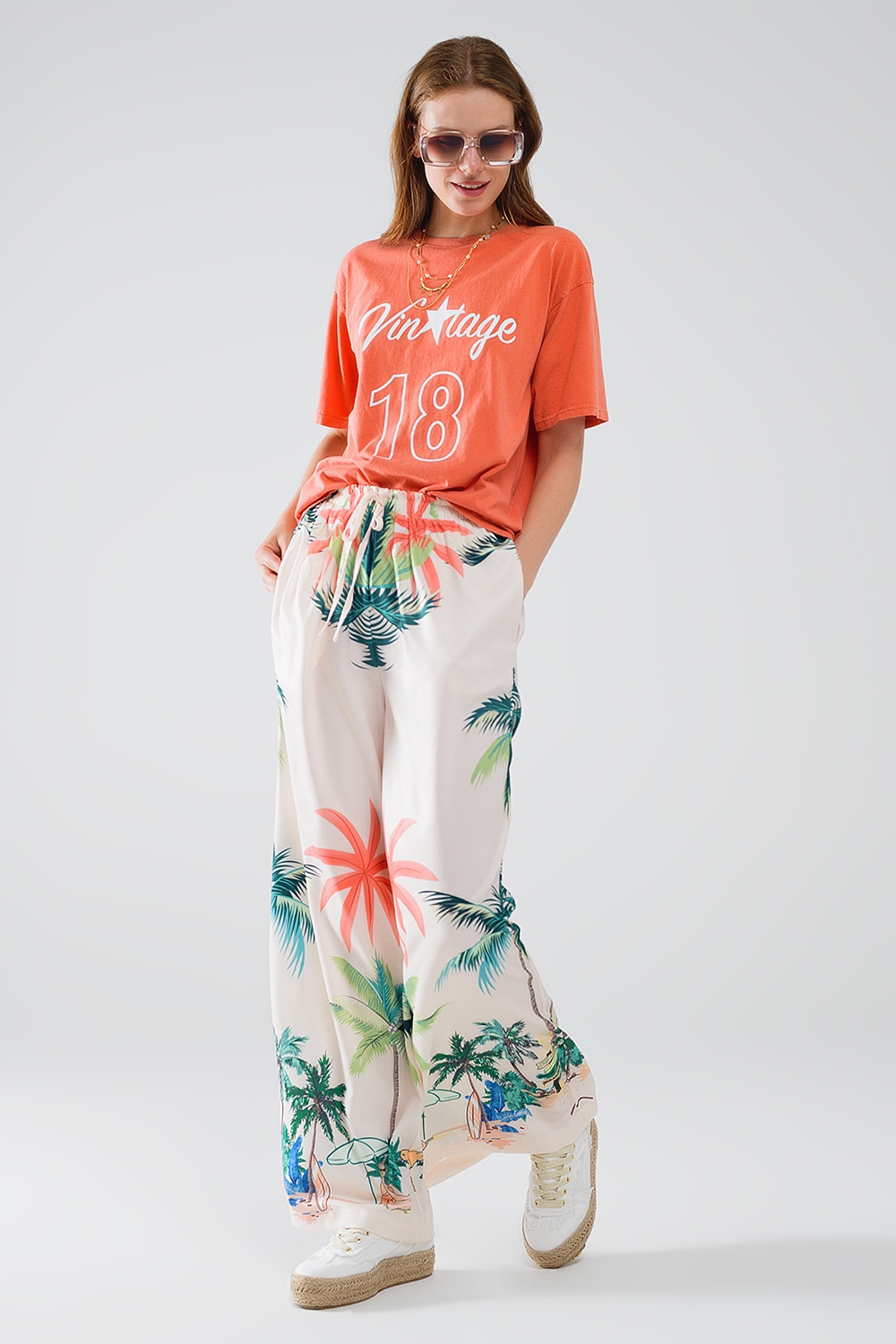 Pantal&oacute;n recto crema con estampado playero y cintura el&aacute;stica